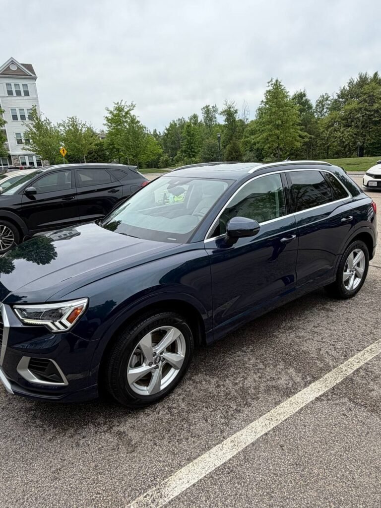 Black Audi sedan side exterior view after complete mobile detailing by Deelway in Massachusetts