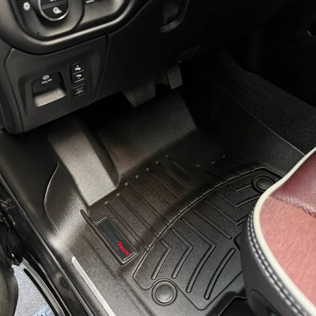 Clean rear seats with center armrest in luxury SUV after professional mobile detailing Massachusetts